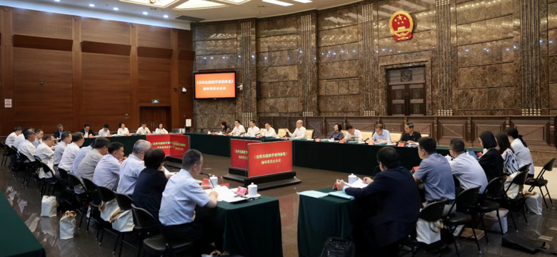张军会见《法科实践教学案例参鉴》编审委员会专家学者